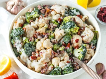 broccoli cauliflower salad with a silver spoon