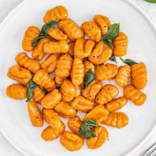 sweet potato gnocchi with sage on a plate