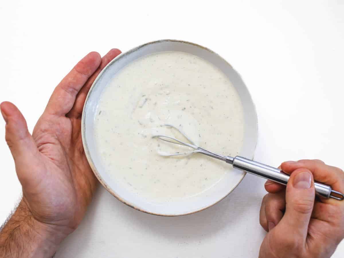 vegan ranch dressing with hands