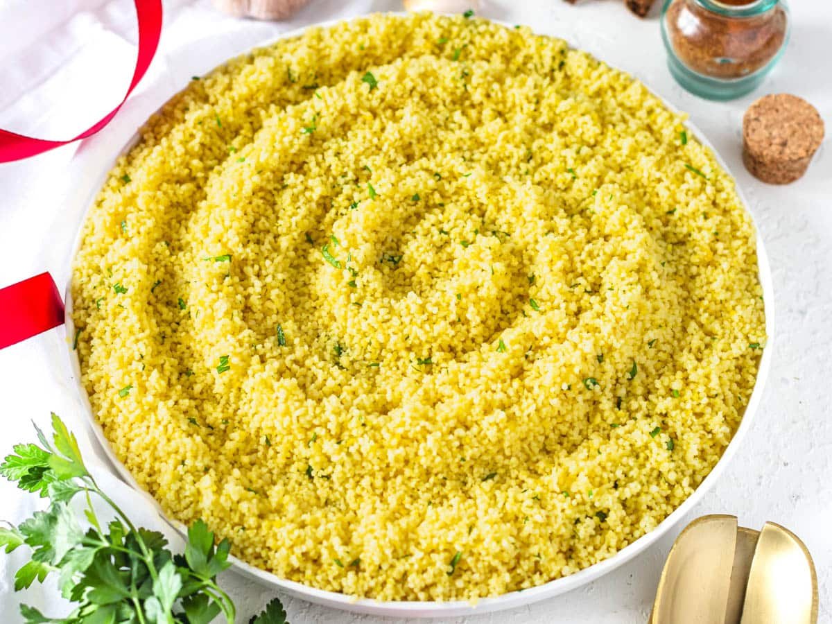 Couscous with chopped parsley on a plate