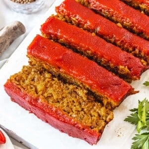 Lentil loaf cut into slices with ketchup sauce