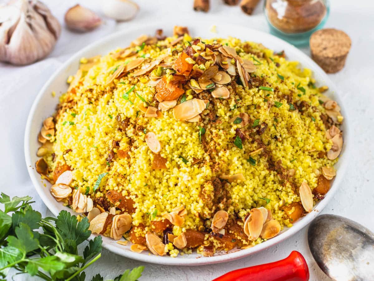 Moroccan couscous with nuts and dried fruit on a plate
