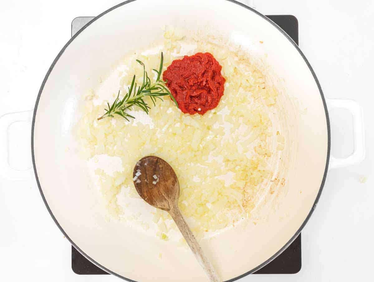 Step 1 Chopped onion cooking gently in olive oil in a wide pan.