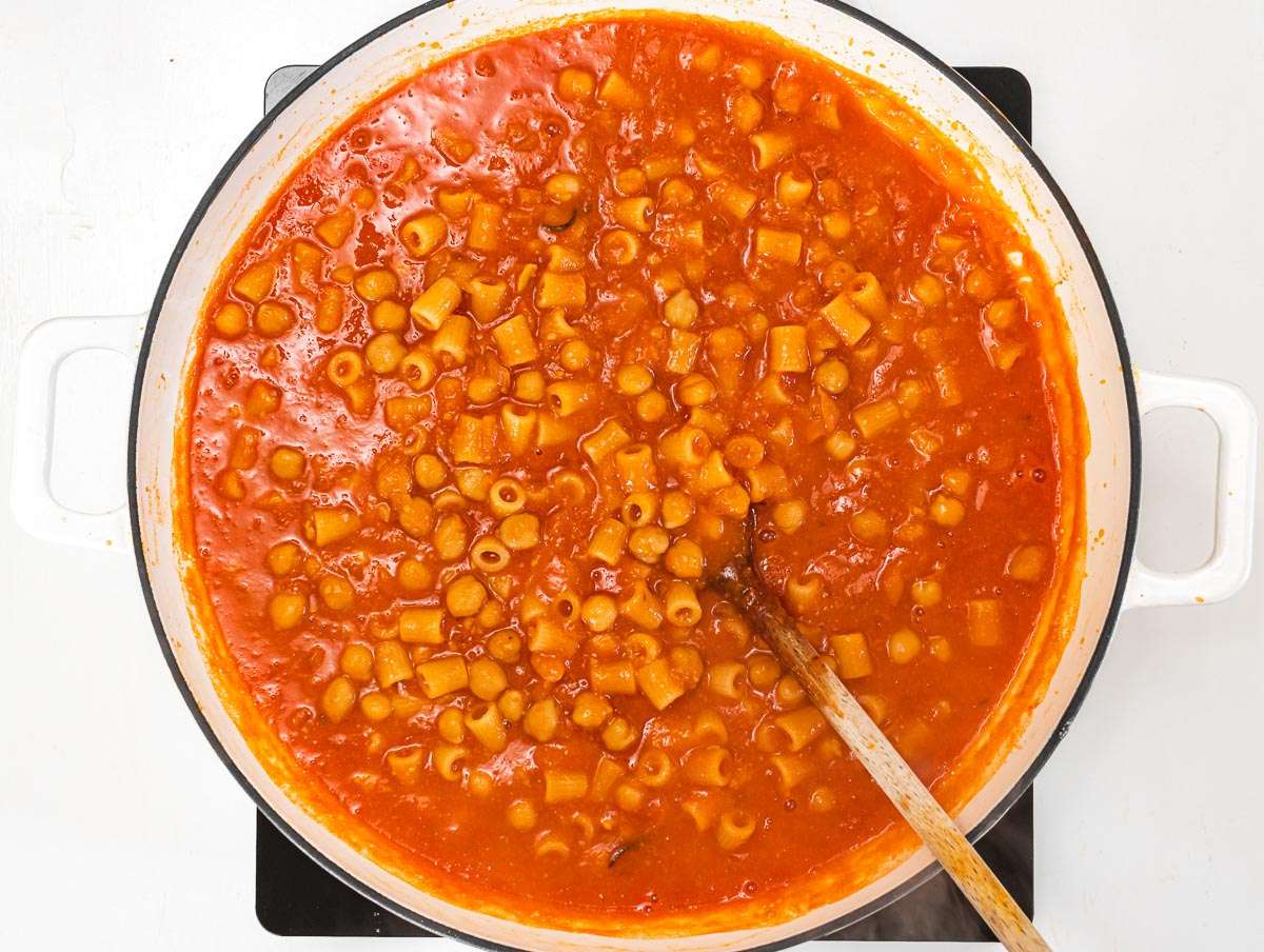 Step 3 Pasta cooking directly in the chickpea sauce, being stirred gently.
