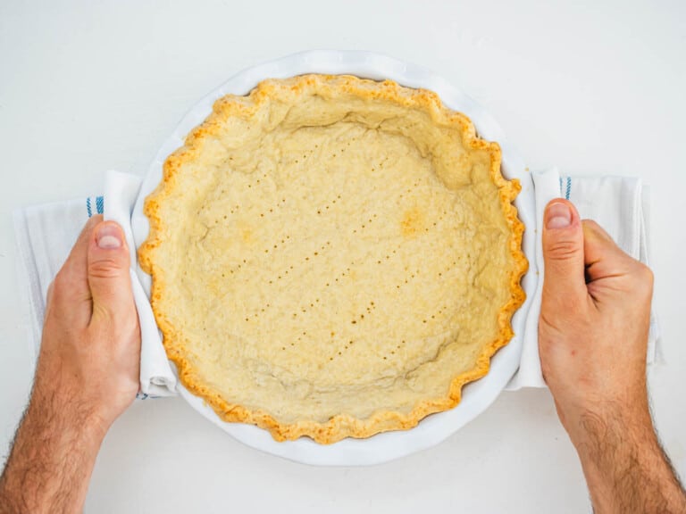 vegan pie crust after baking with hands