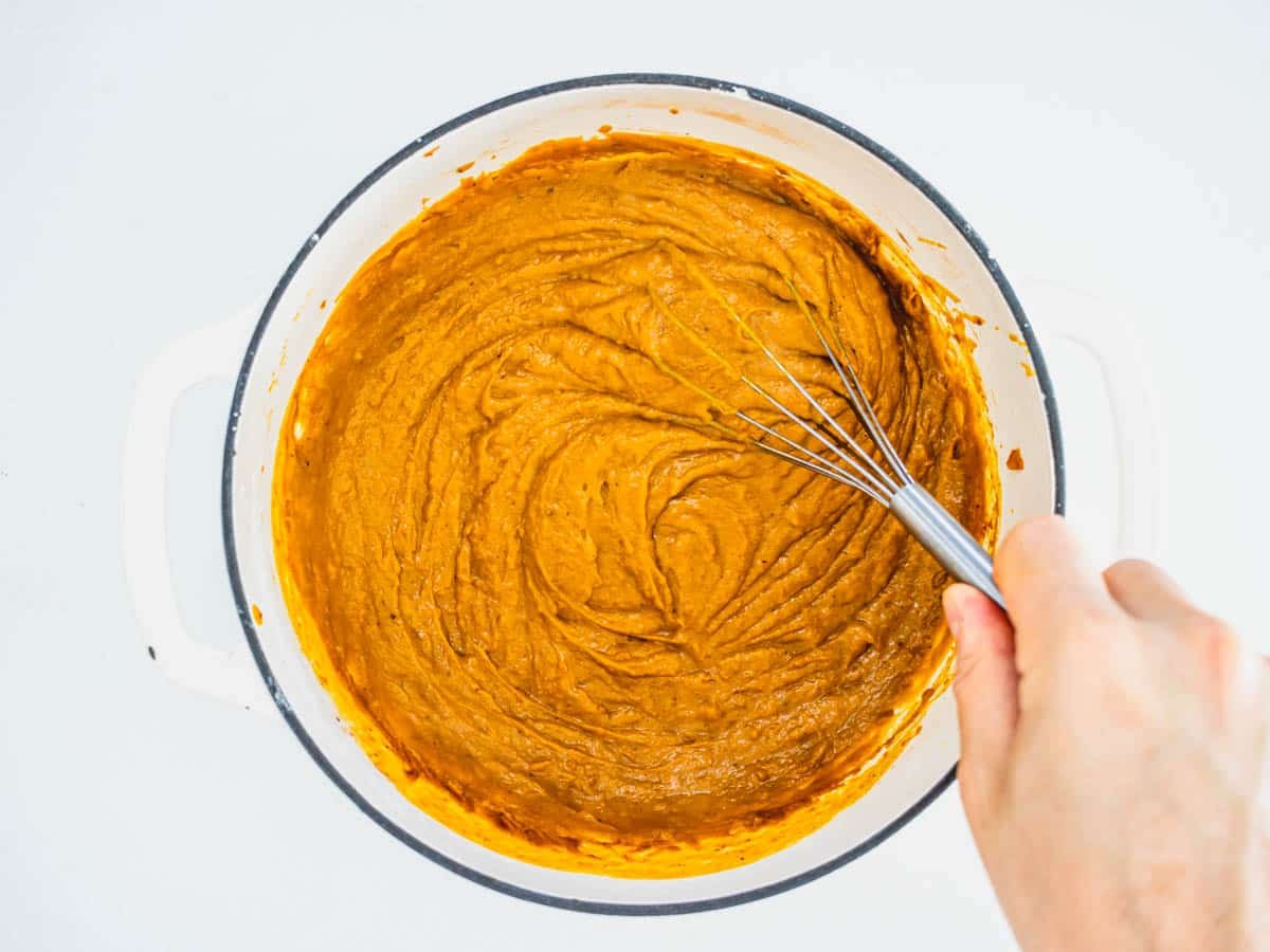 Vegan pumpkin pie filling with hand
