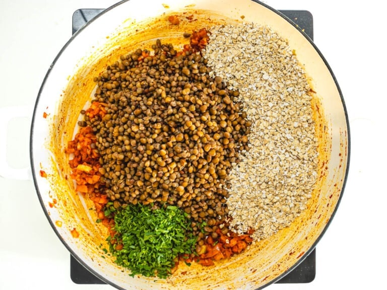 lentils, parsley and oats in a white skillet