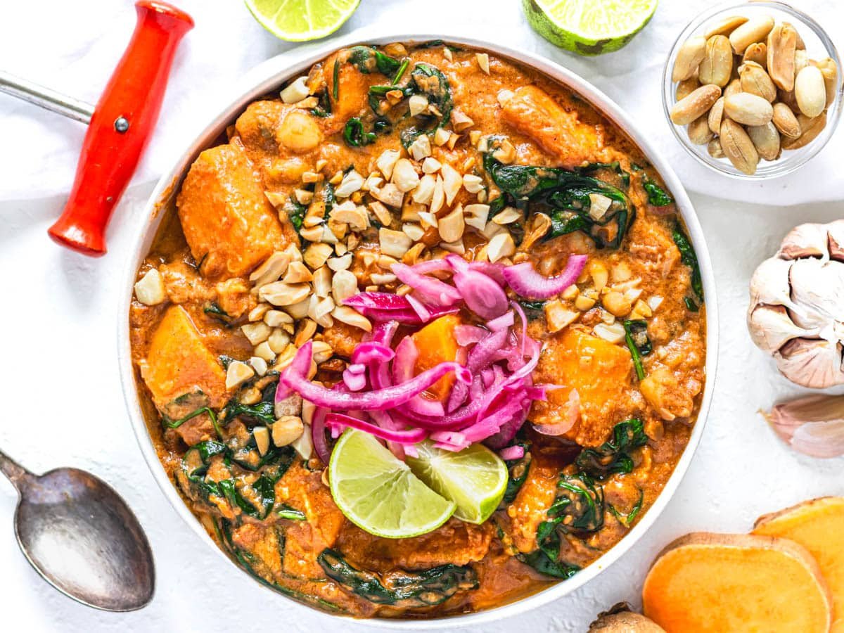 African Peanut Stew in a bowl topped with lime