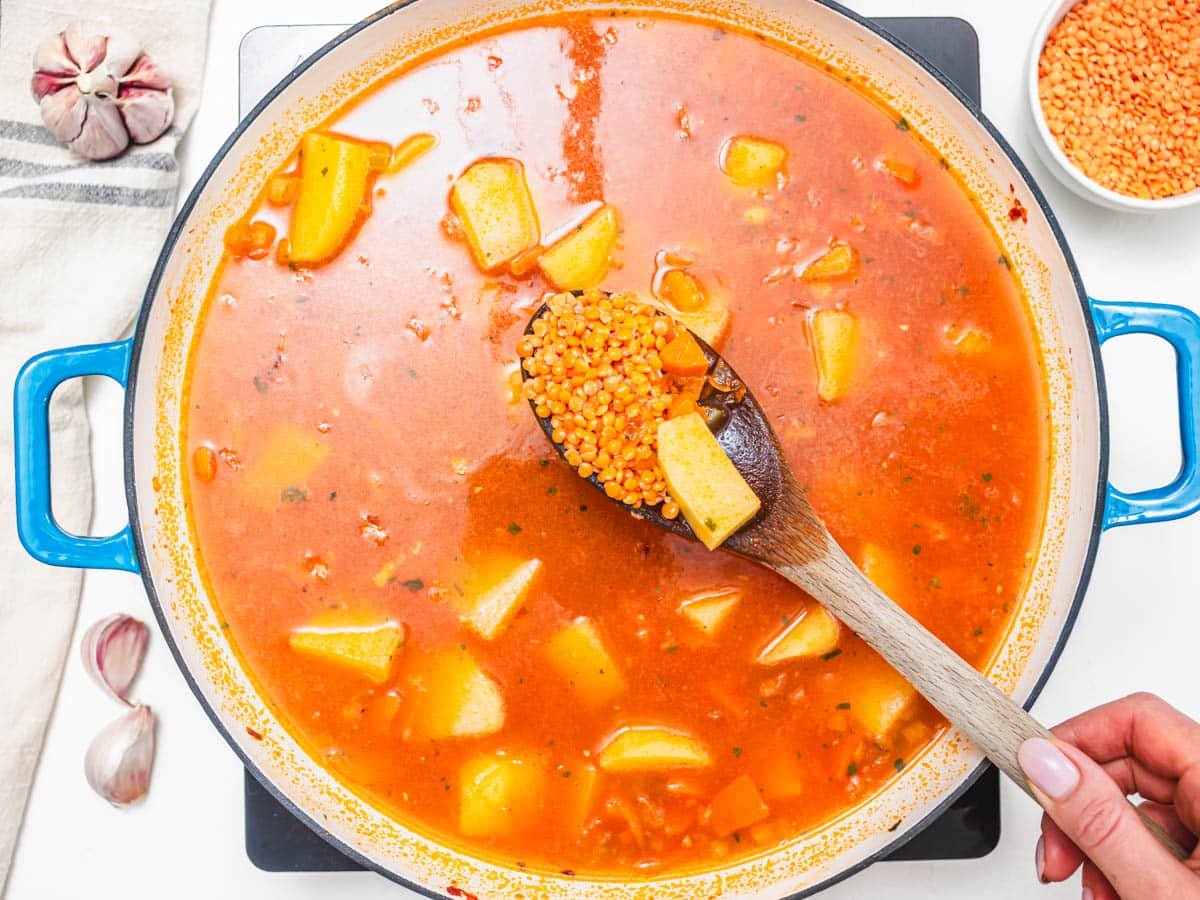 split red lentils in a tomato broth with potato chunks