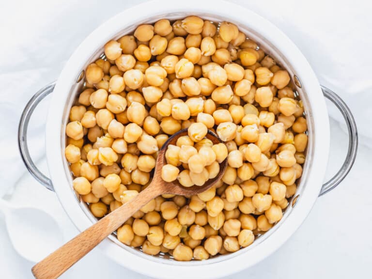 drained and cooked chickpeas in a white sift