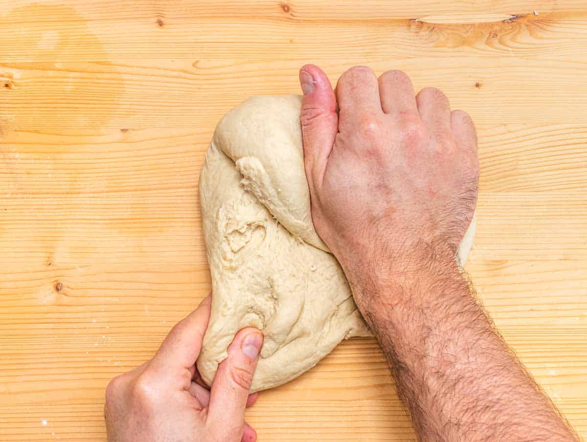 kneading the dough for vegan croissants