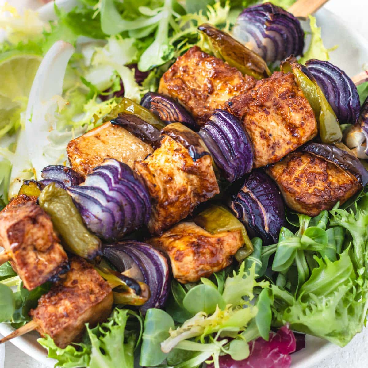 Baked tofu on salad with vegetables