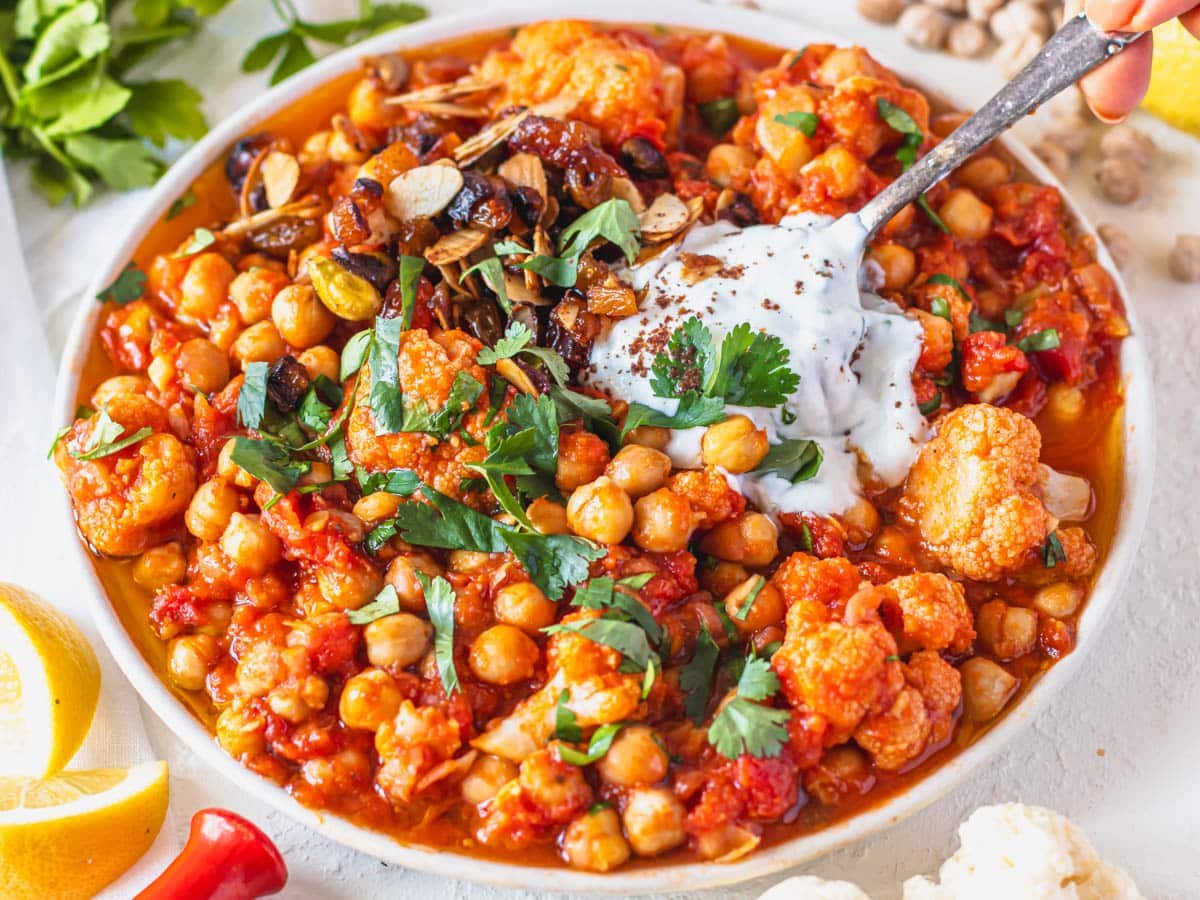 Moroccan chickpea stew with yogurt and fresh cilantro on top