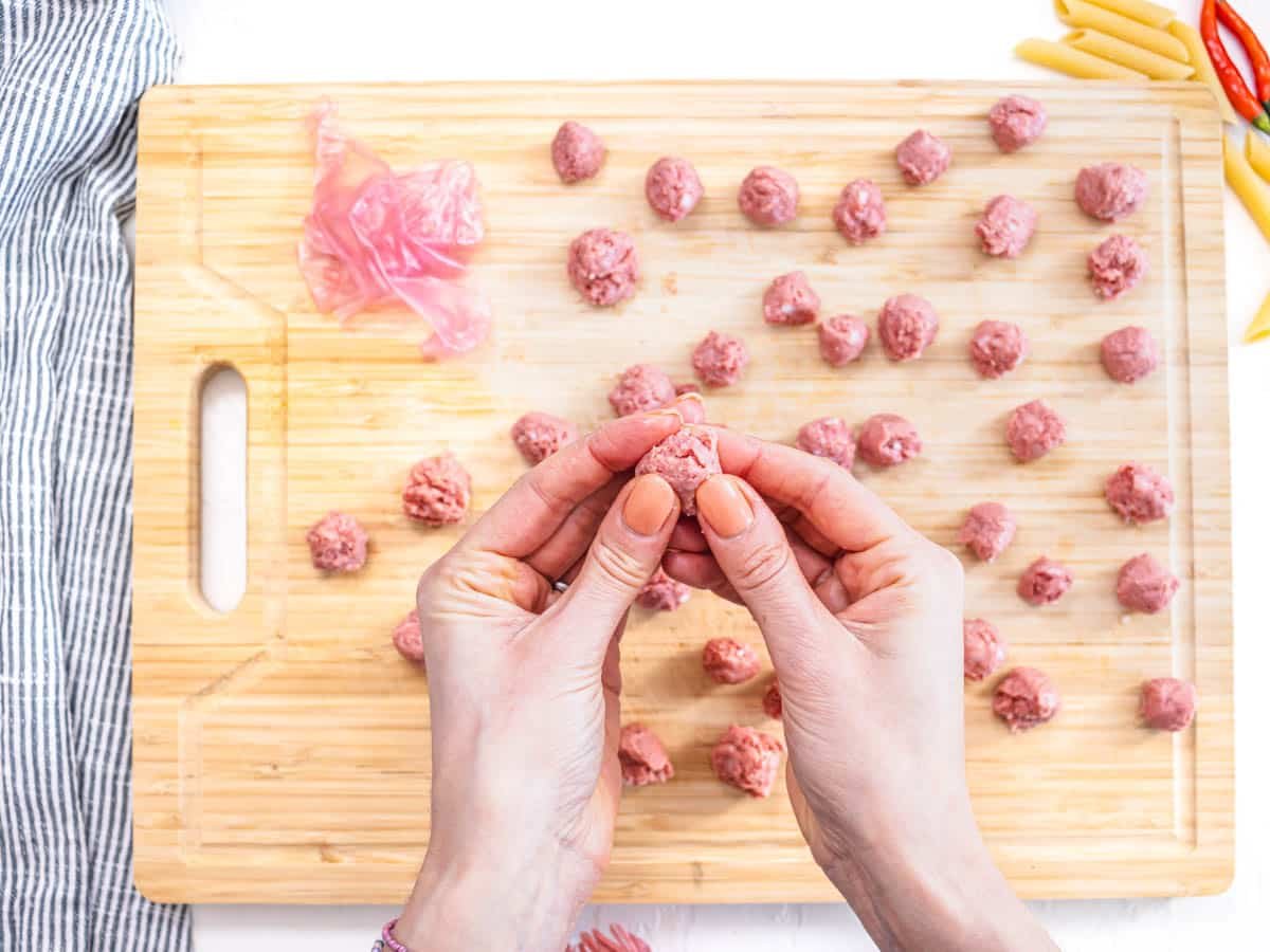 hands preparing plant-based meatballs