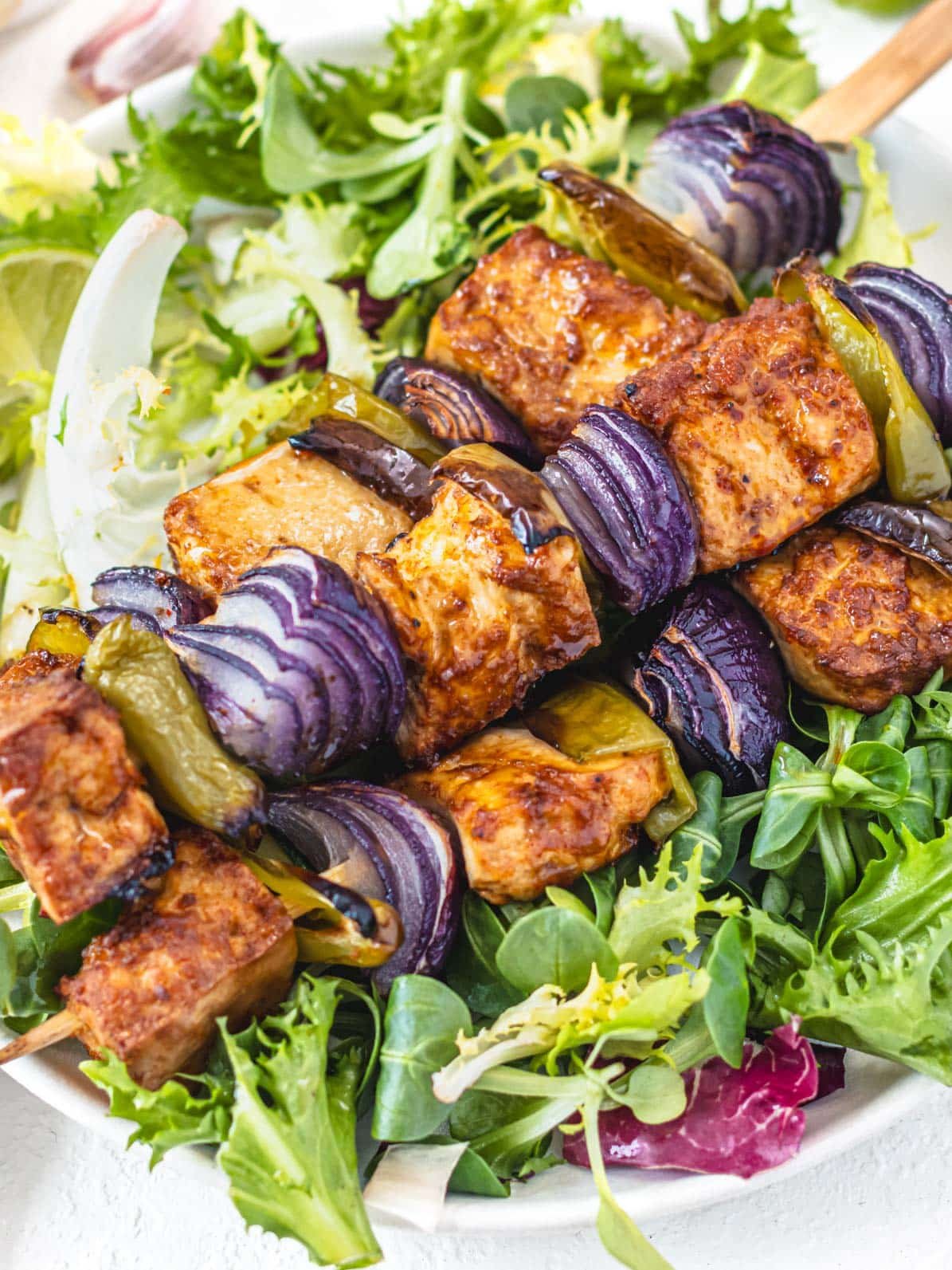 Baked tofu on skewers with onion