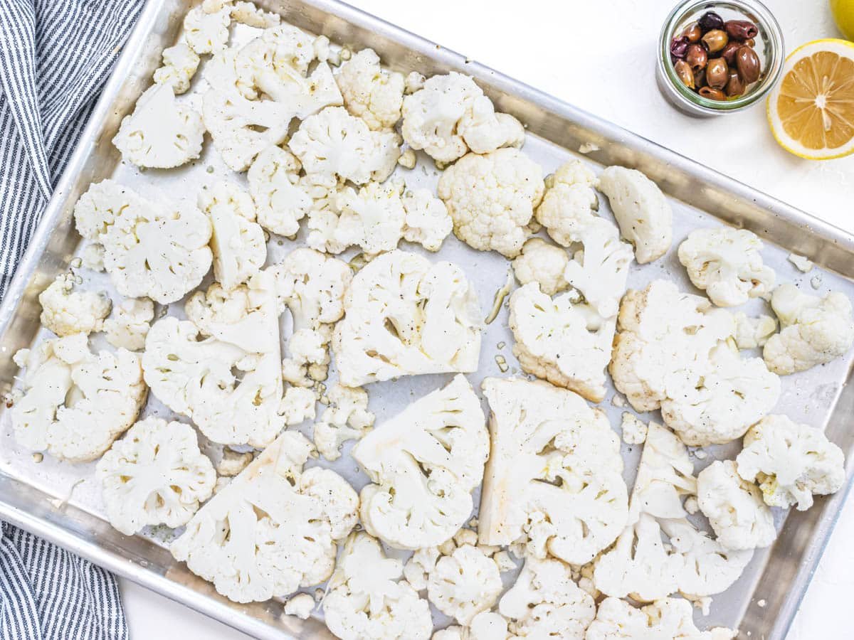 cauliflower pieces on a baking tray