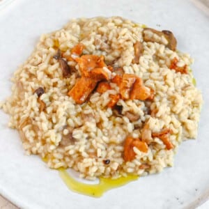vegetable risotto on a plate with olive oil