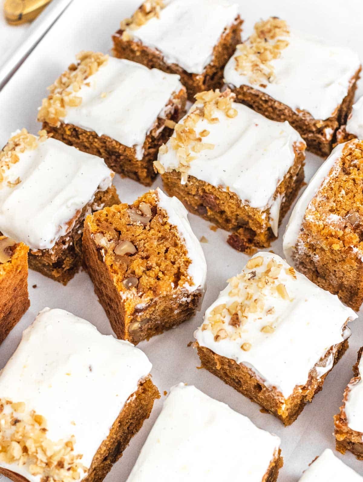 Carrot cake with frosting and walnuts