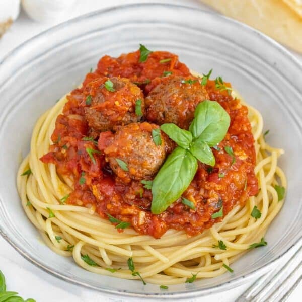 Italian vegan recipes with tofu meatballs and spaghetti.