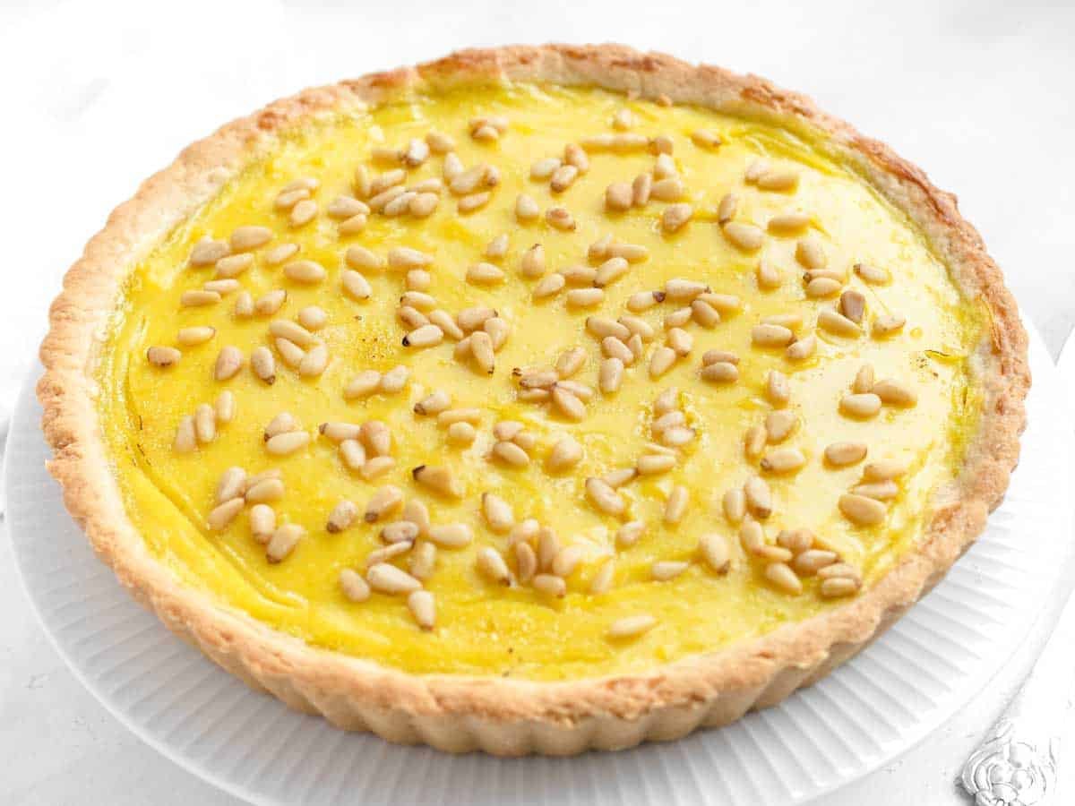 custard pie after baking with pine nuts