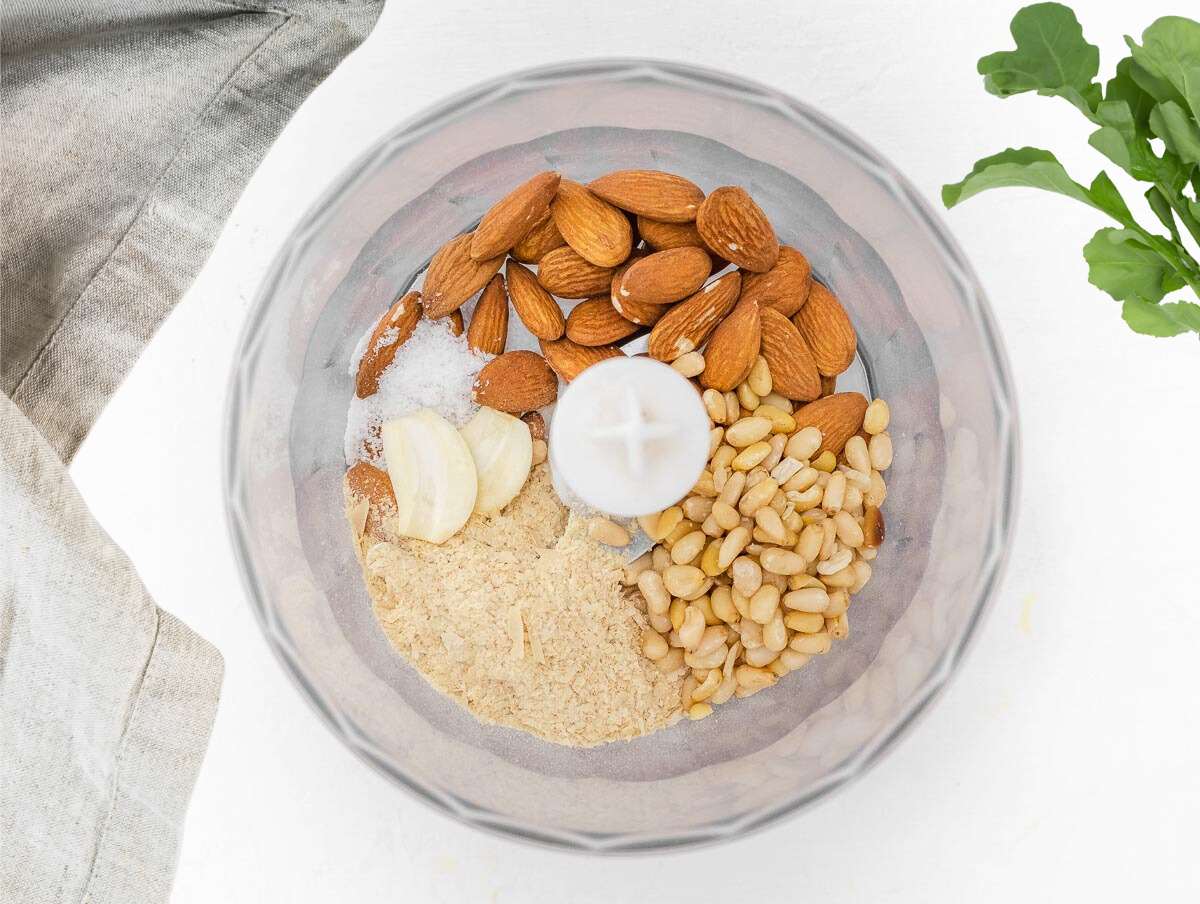 almonds, pine nuts and garlic in a food processor