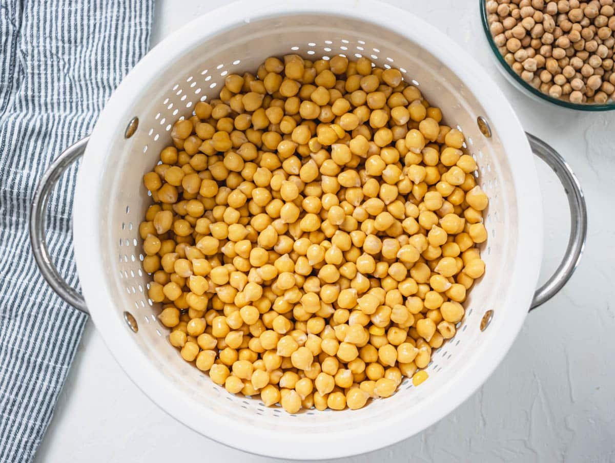 rinsed soaked chickpeas in a white sift