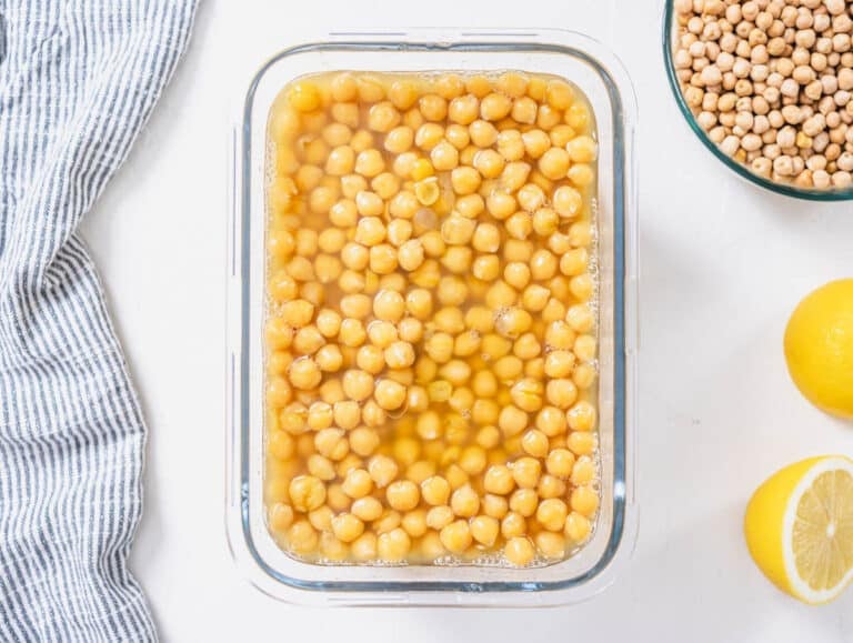 cooked chickpeas in cooking water stored in an airtight container