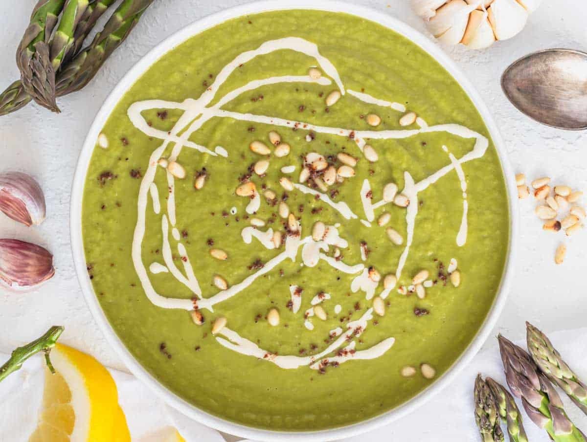 Asparagus soup with pine nuts