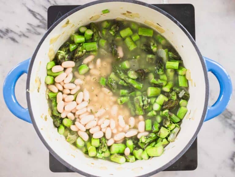 asparagus and cannellini beans in a Dutch oven