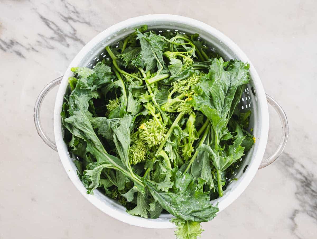 broccoli rabe in a white sift