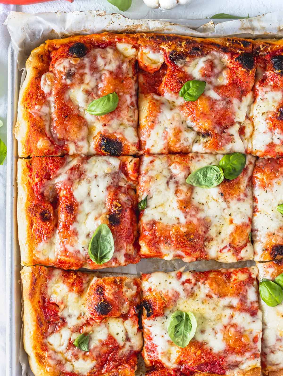 tomato mozzarella focaccia pizza cut into squares