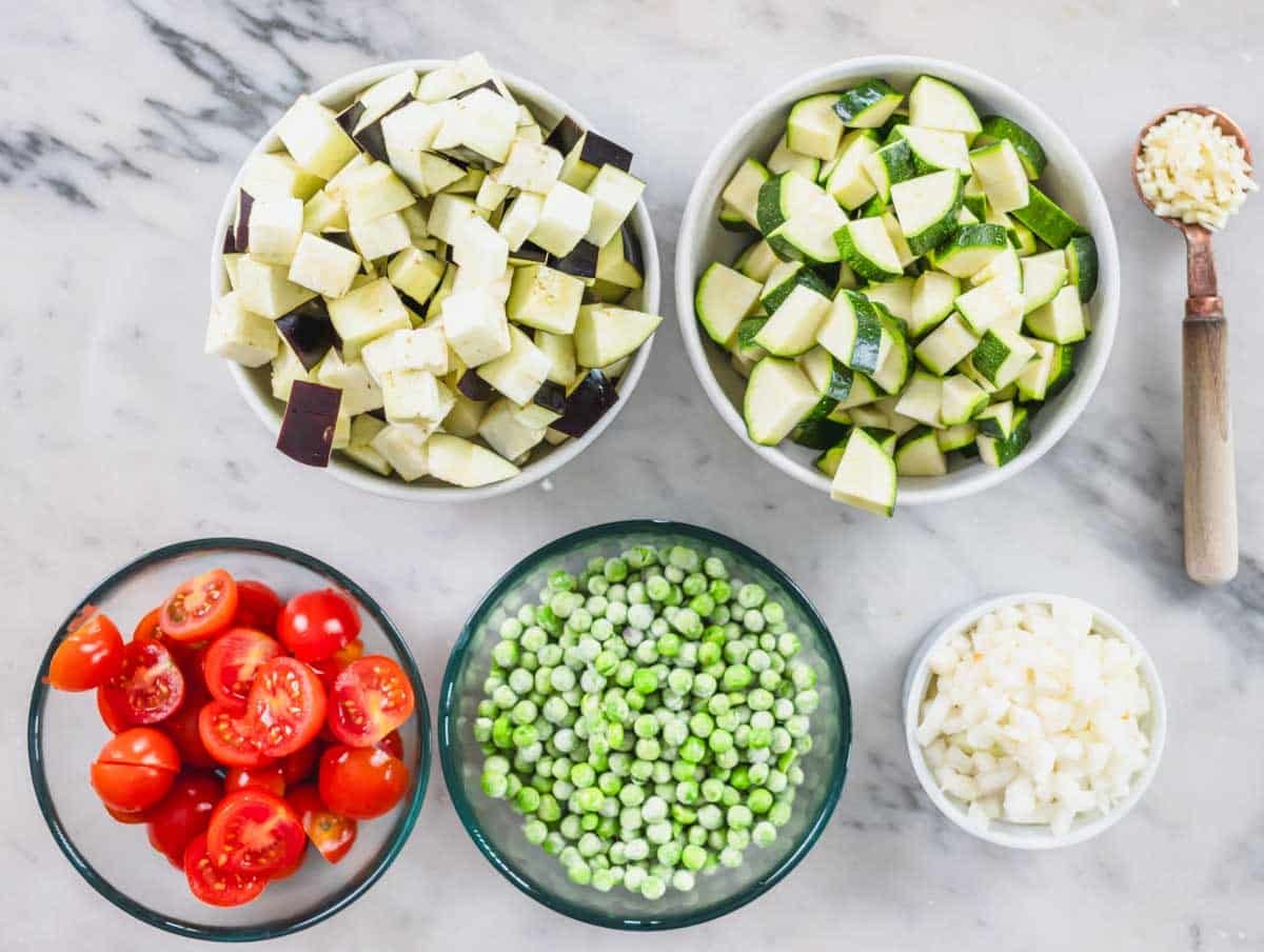 vegetables and frozen peas in bowls