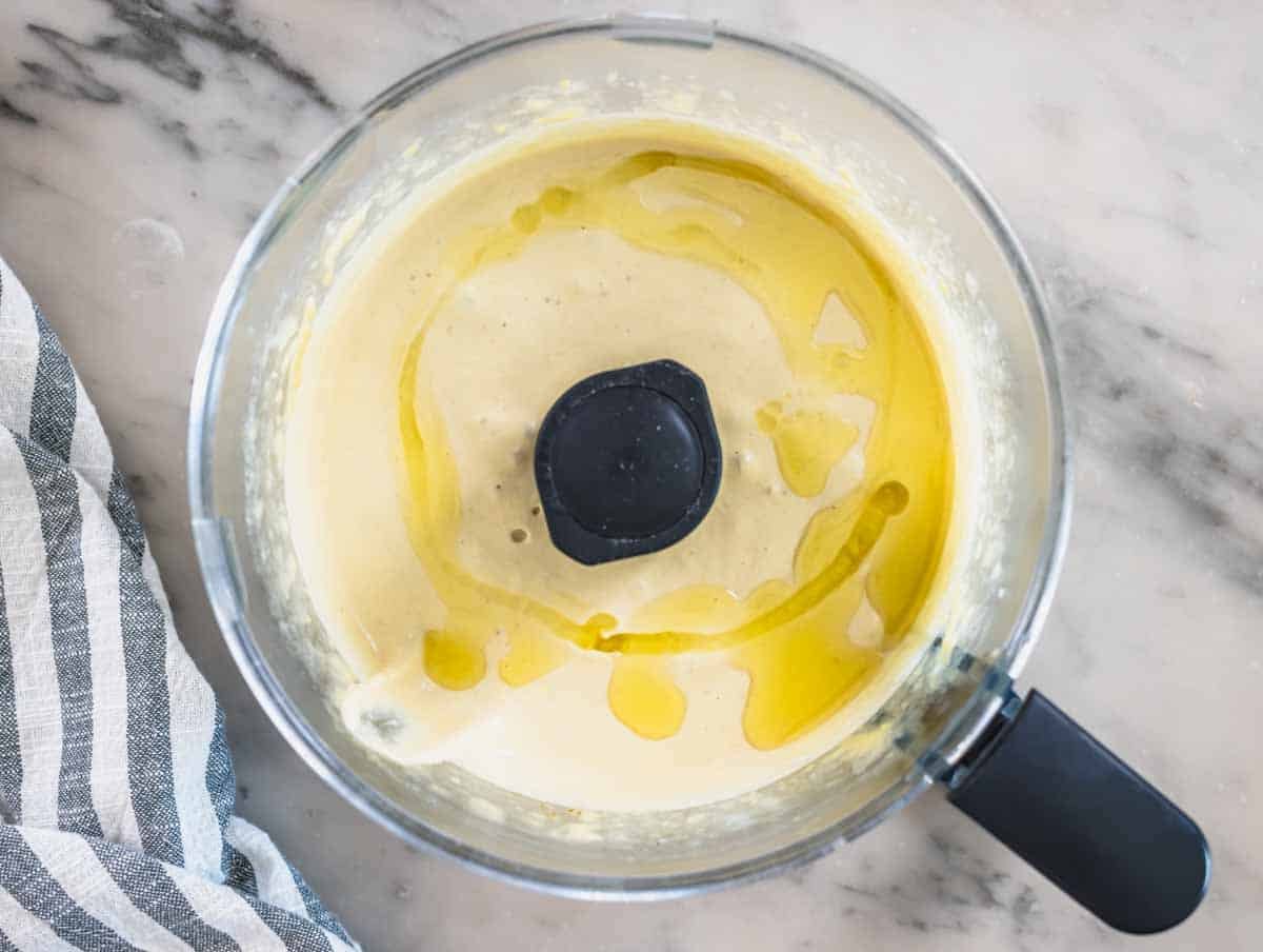 Hummus with olive oil in a food processor
