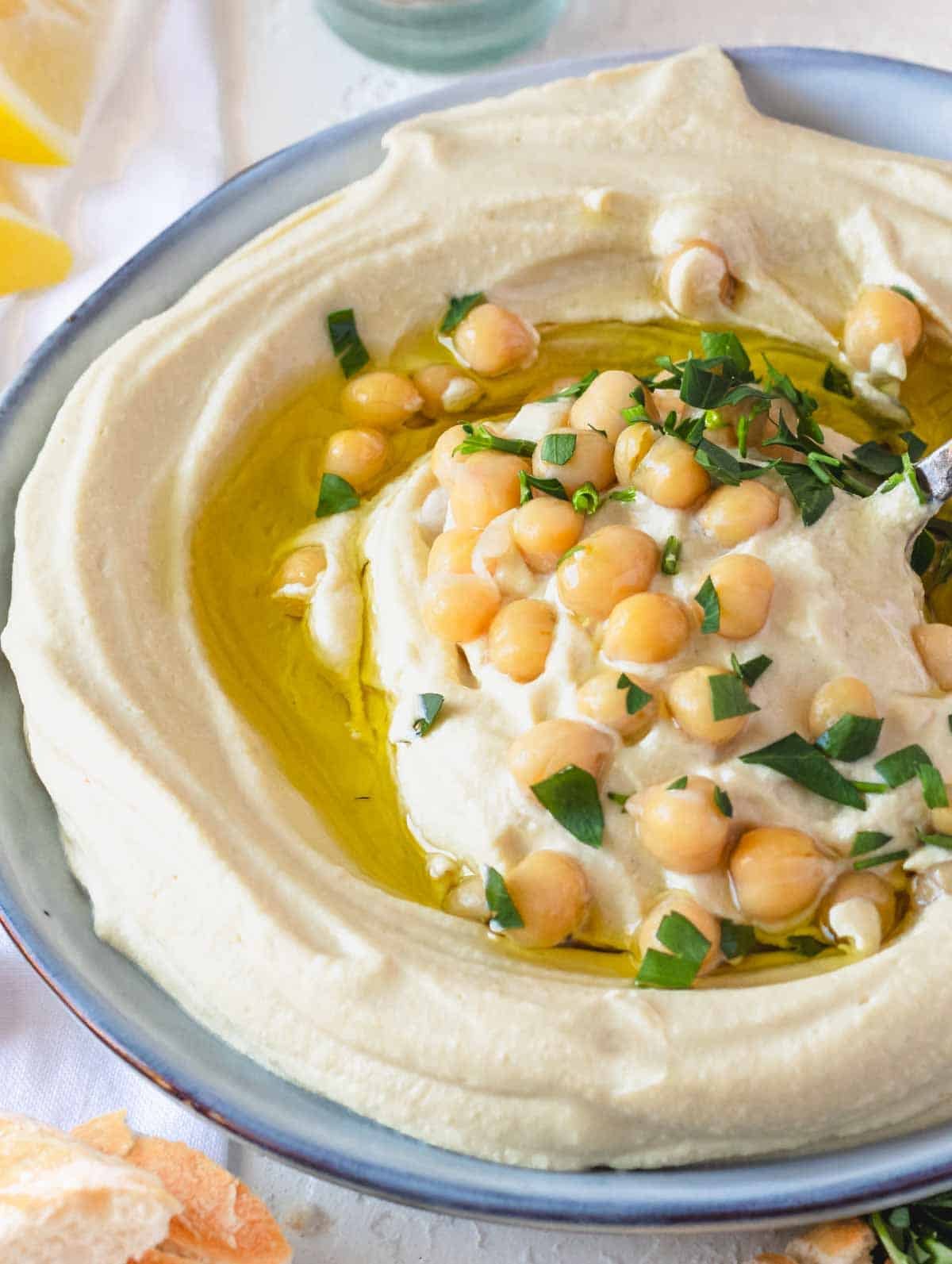 Hummus recipe on a plate with parsley