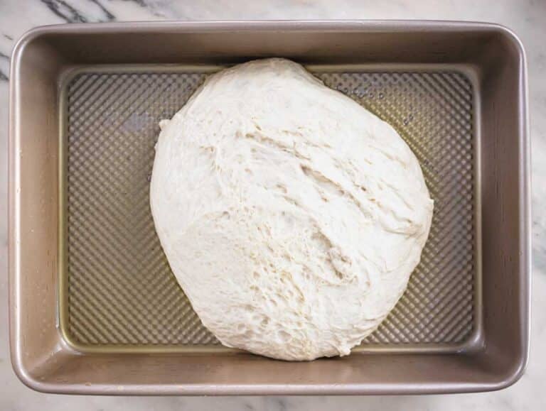 focaccia dough in the baking pan