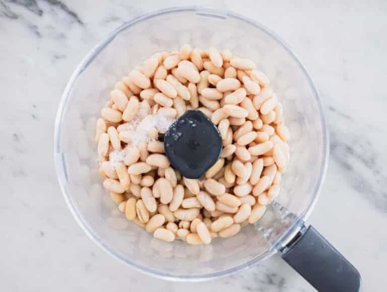cannellini beans with salt in a food processor