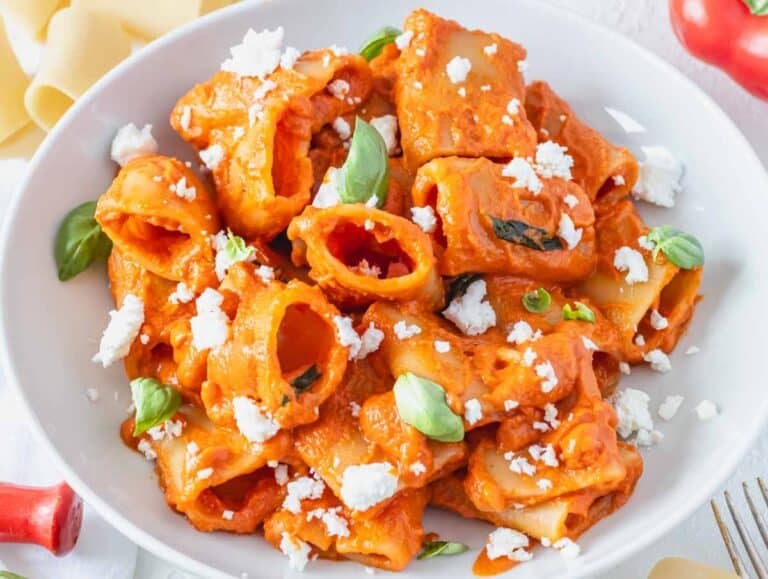 high protein vegan pasta with silken tofu and fresh basil leaves