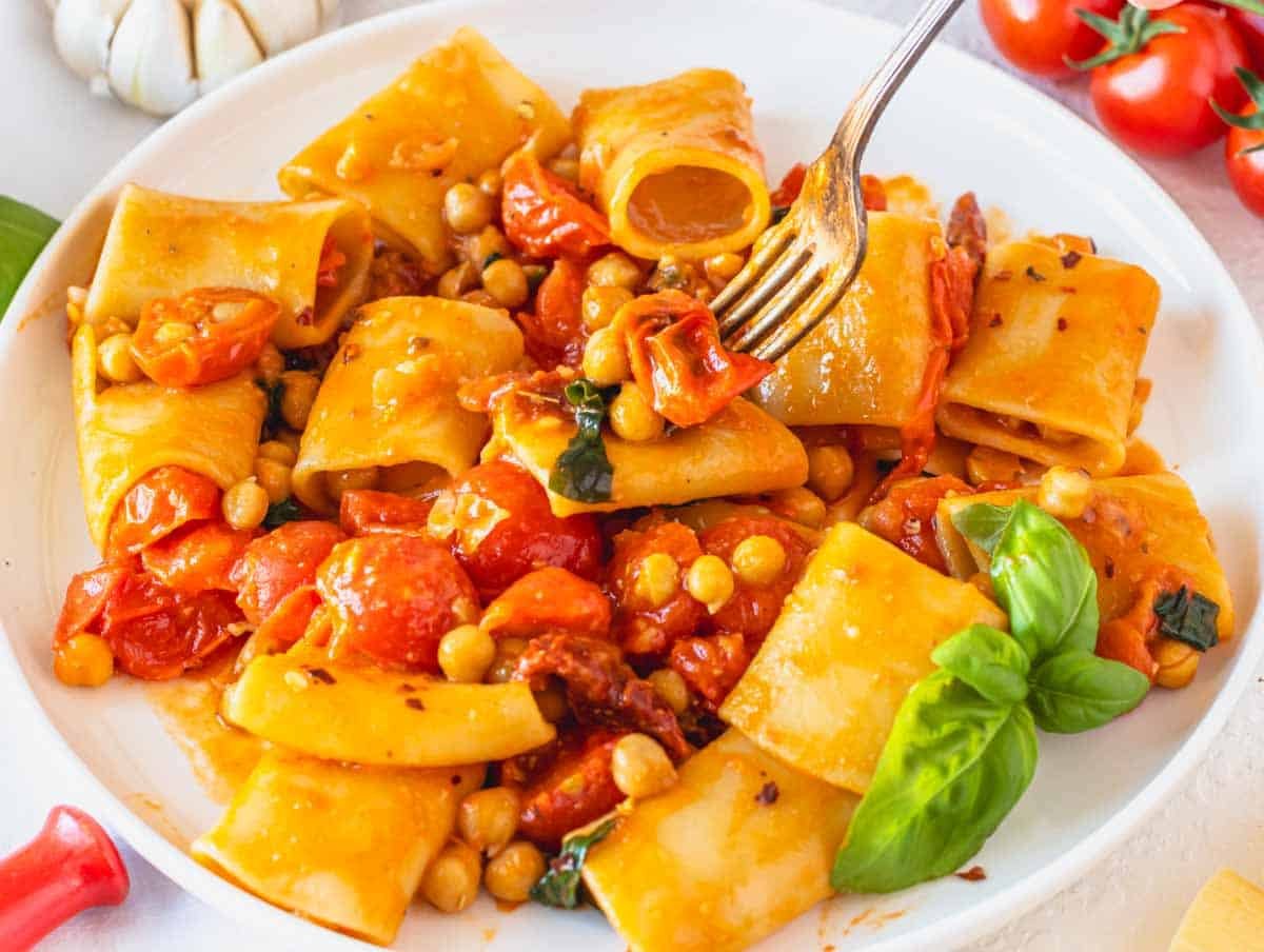 paccheri pasta with fork and chickpeas