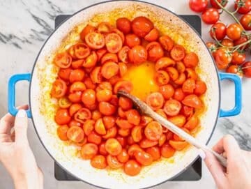 cherry tomatoes in a blue skillet
