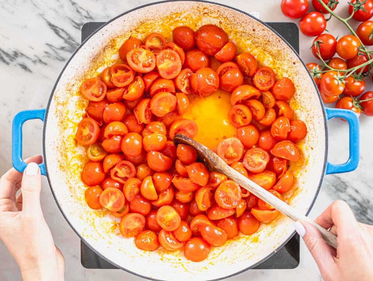 cherry tomatoes in a blue skillet