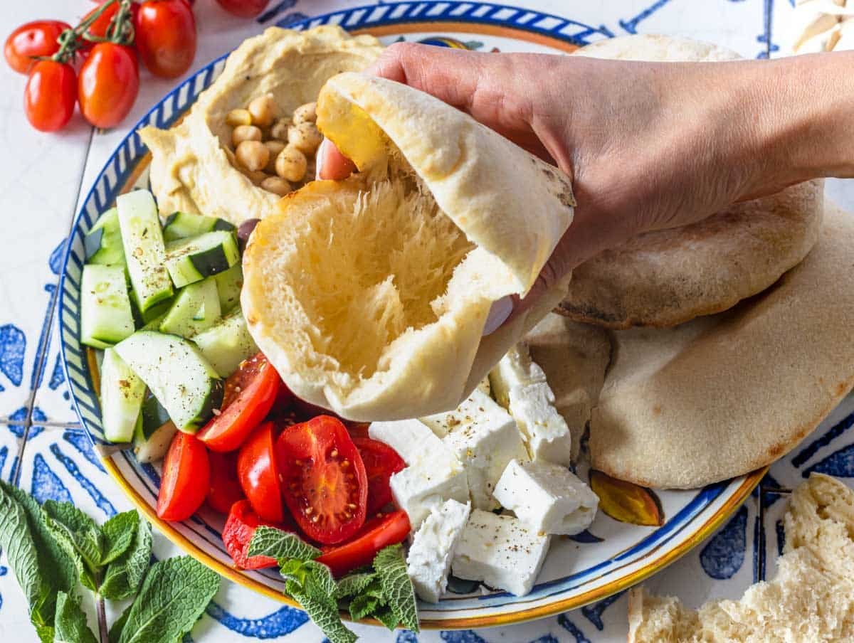 pita bread pocket served with cucumber and tomatoes