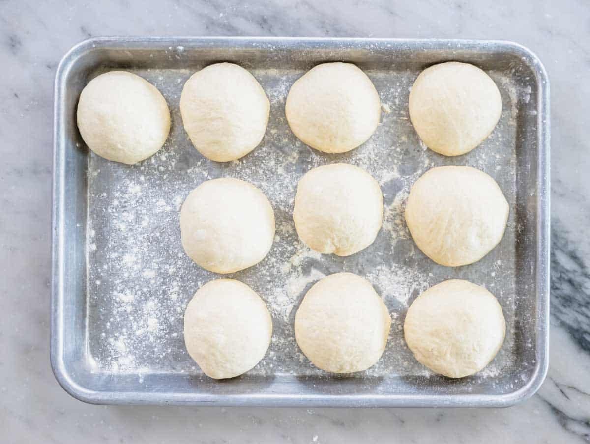 pita dough balls on a baking trey