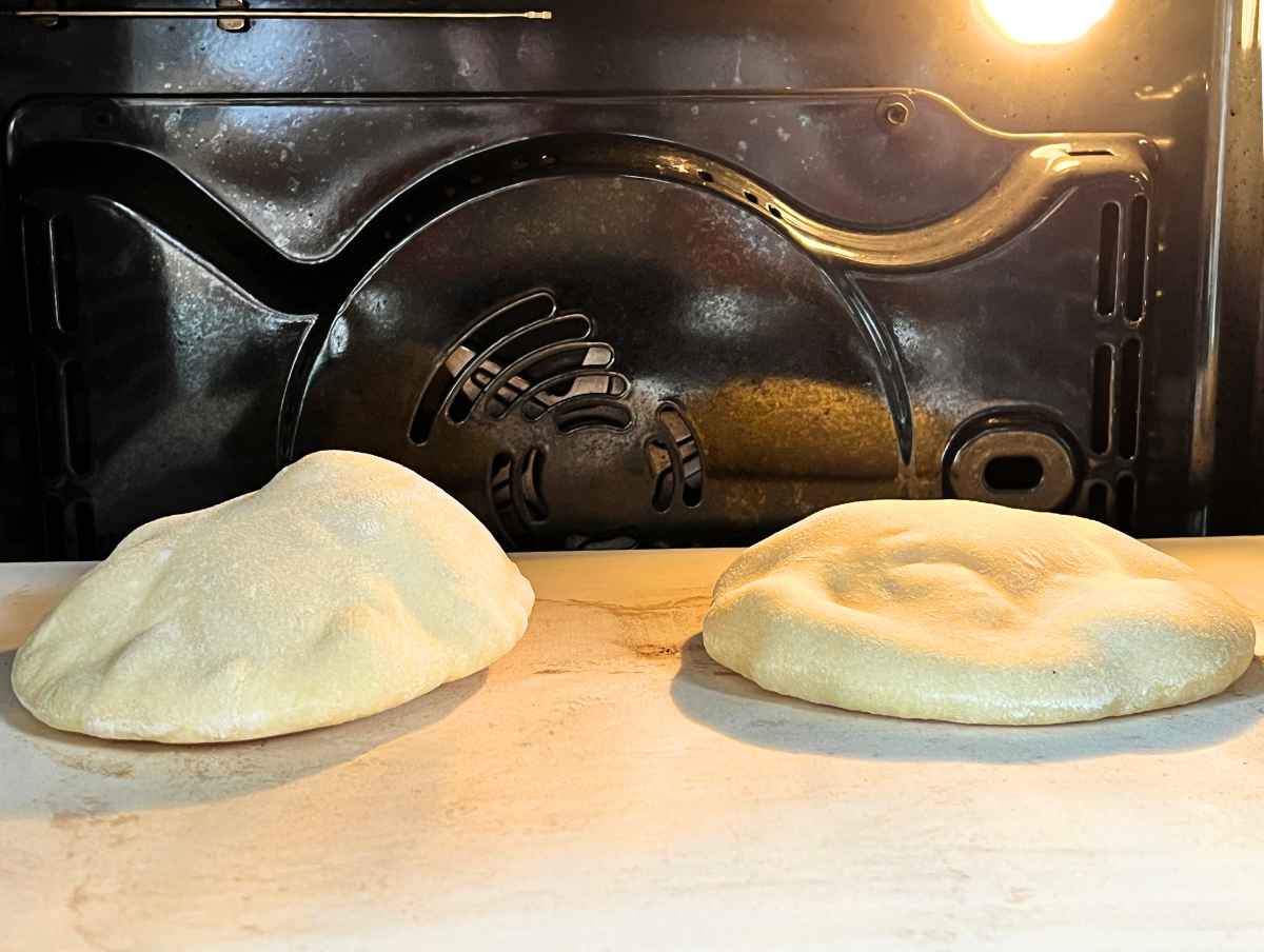 pita bread cooking in the oven