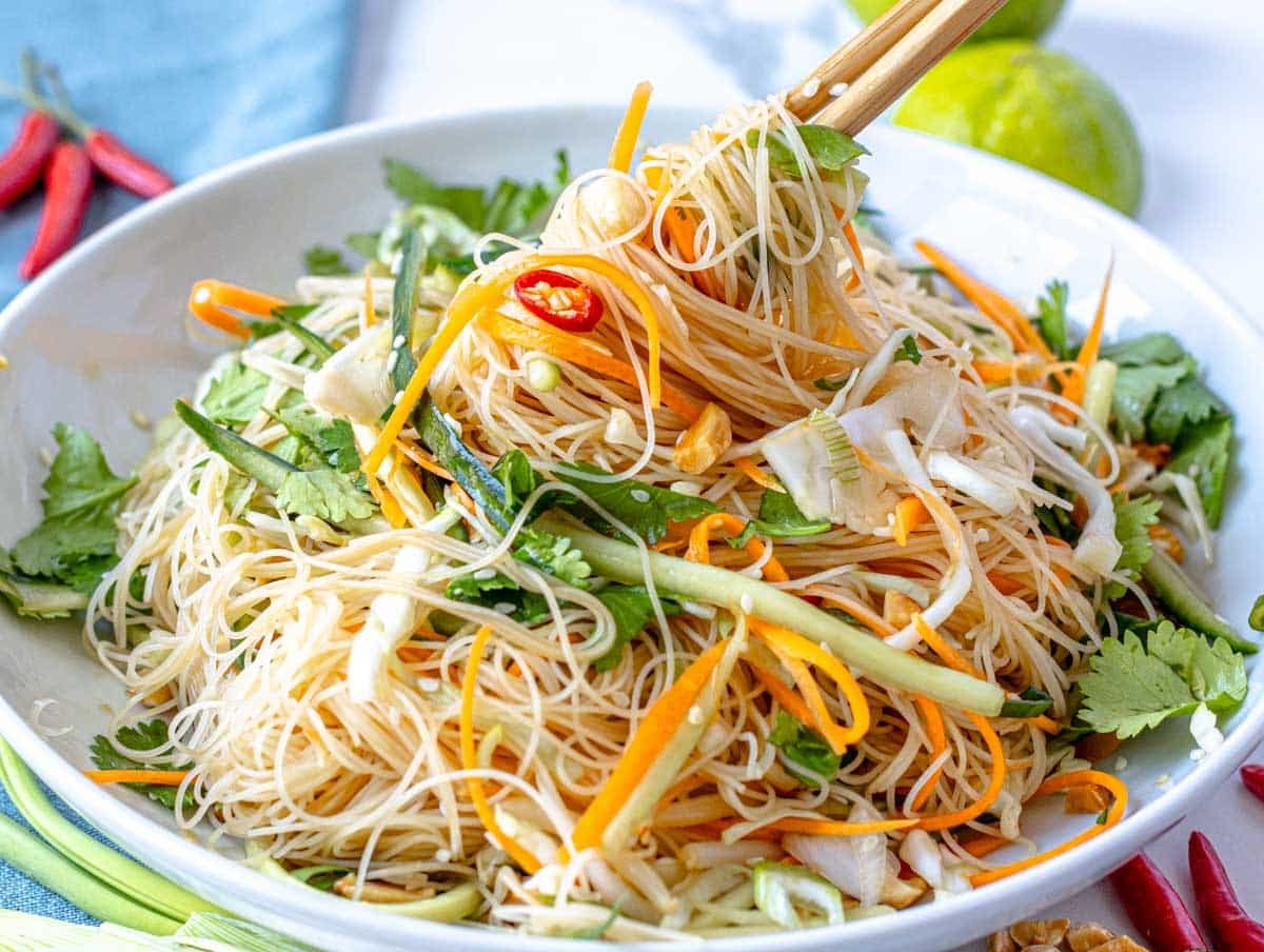 Asian noodle salad with chili and chopsticks