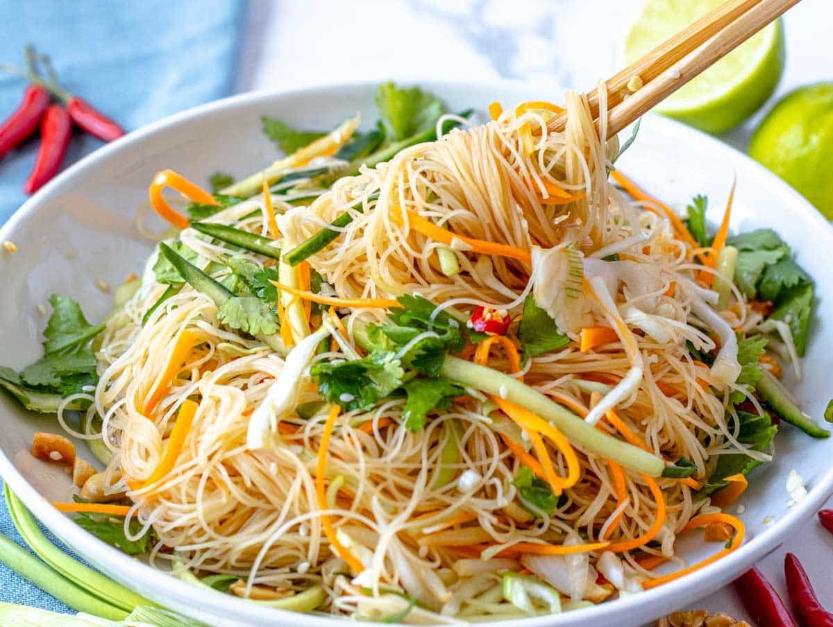 Asian noodle salad with chopsticks and cilantro