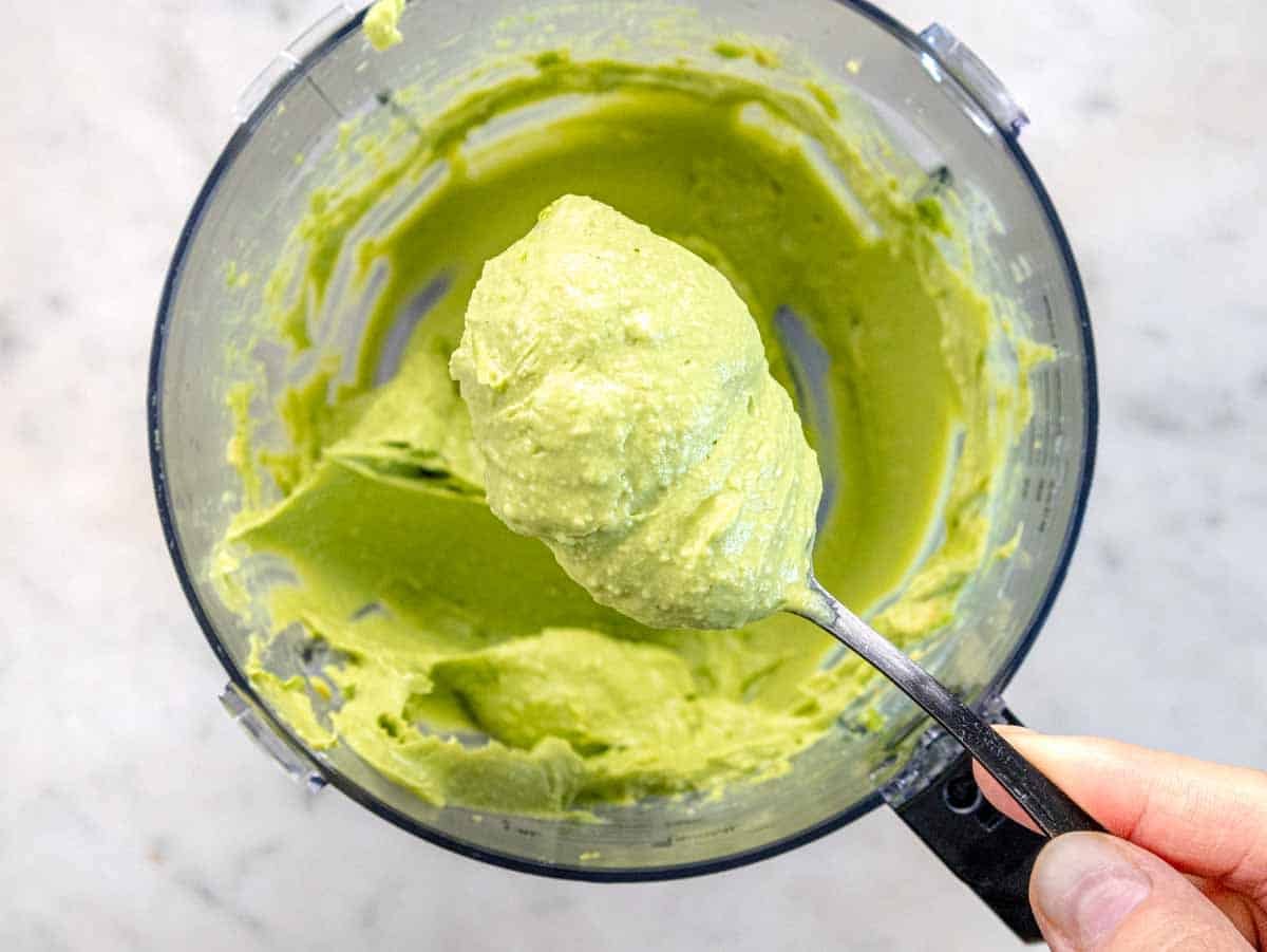 Avocado spread on a spoon after blending