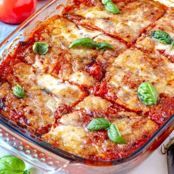Parmigiana with eggplant and fresh basil leaves