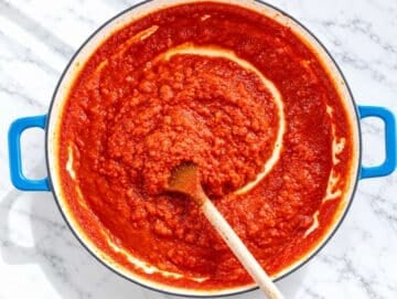 Step 1 Onion, garlic, and tomato passata simmering into a rich homemade sauce.