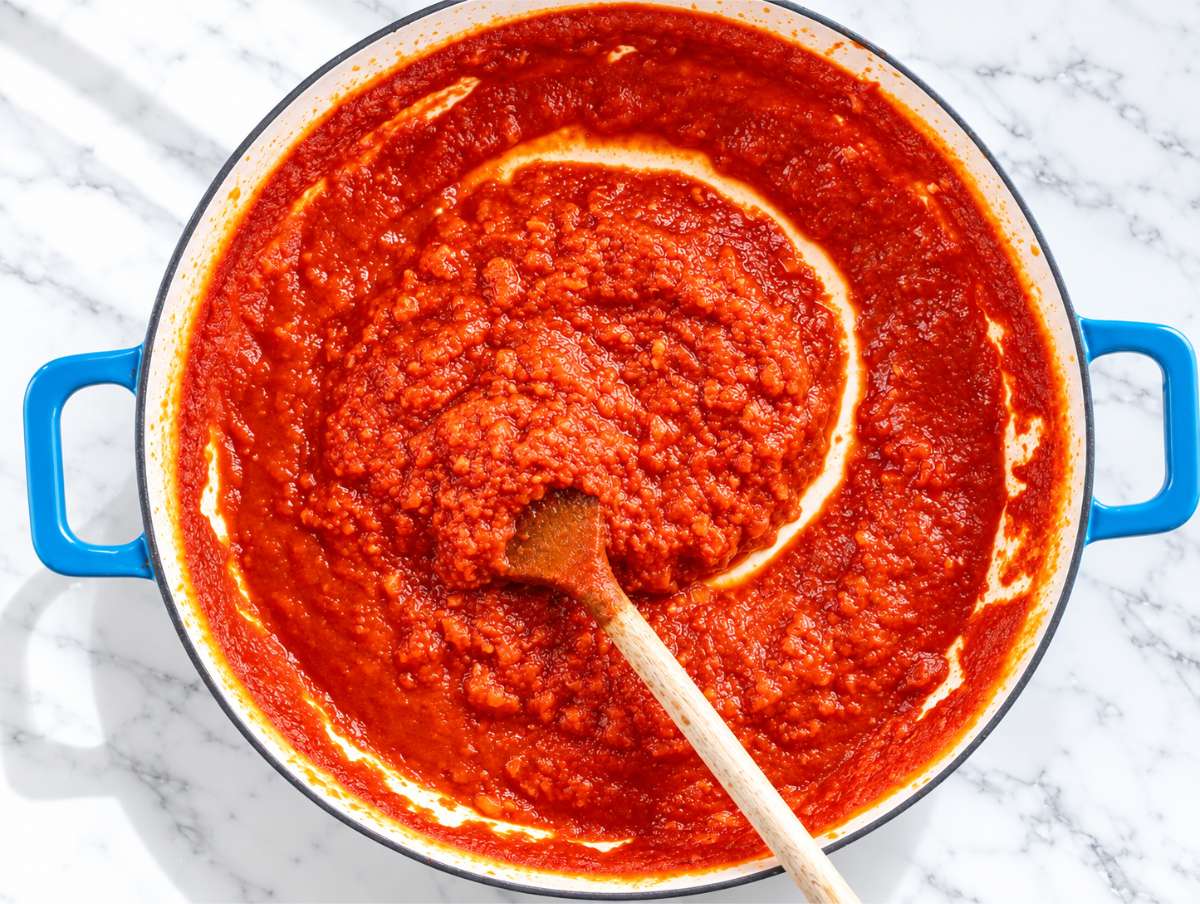 Step 1 Onion, garlic, and tomato passata simmering into a rich homemade sauce.