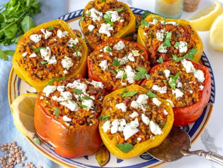 Step 3 Serving colorful bell peppers stuffed with spiced rice and topped with feta.